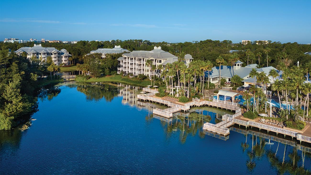 Aerial view of exterior of Marriott's Cypress Harbour resort timeshare location from the water's edge